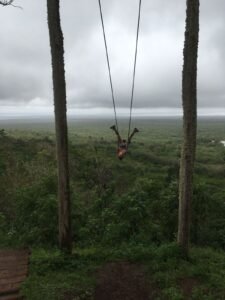 Siobhan Brier Aguilar on a swing in the Galapagos columpio magico